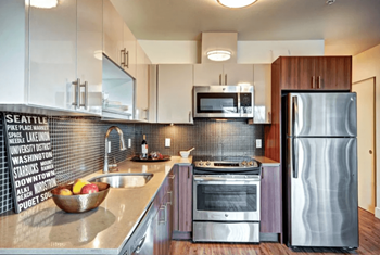 Quartz countertops with tile backsplash